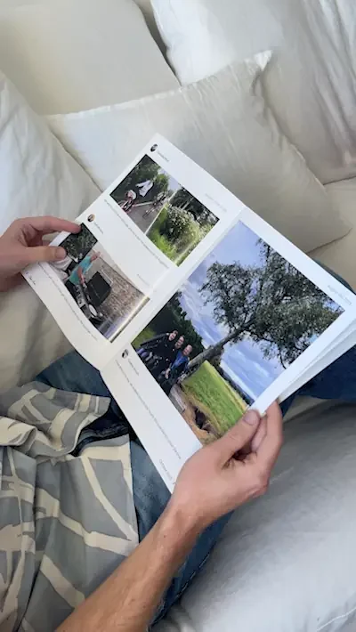 A Cher Ami magazine open on a page of family photos